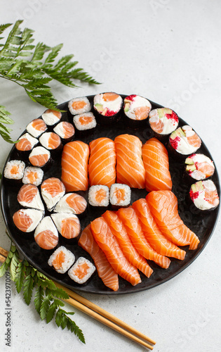 Beautiful festive set of sushi and rolls with salmon