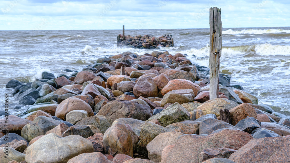 Baltic Sea, rocks at sunset. small waves after a night storm Baltic Sea, rocks at sunset. small waves after a night storm