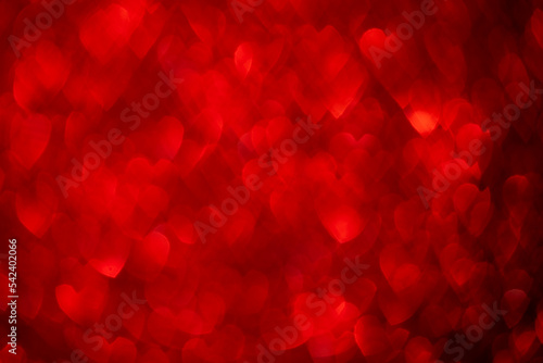 Red hearts, sparkling glitter bokeh background, valentines day abstract defocused texture © MariiaDemchenko