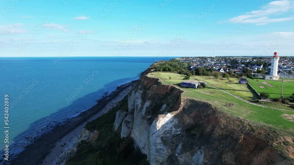 Drone flying over high chalky cliffs near La Hève lighthouse, Sainte-Adresse city, France. Aerial forward. Sky for copy space Drone flying over high chalky cliffs near La Hève lighthouse, Sainte-Adresse city, France. Aerial forward. Sky for copy space