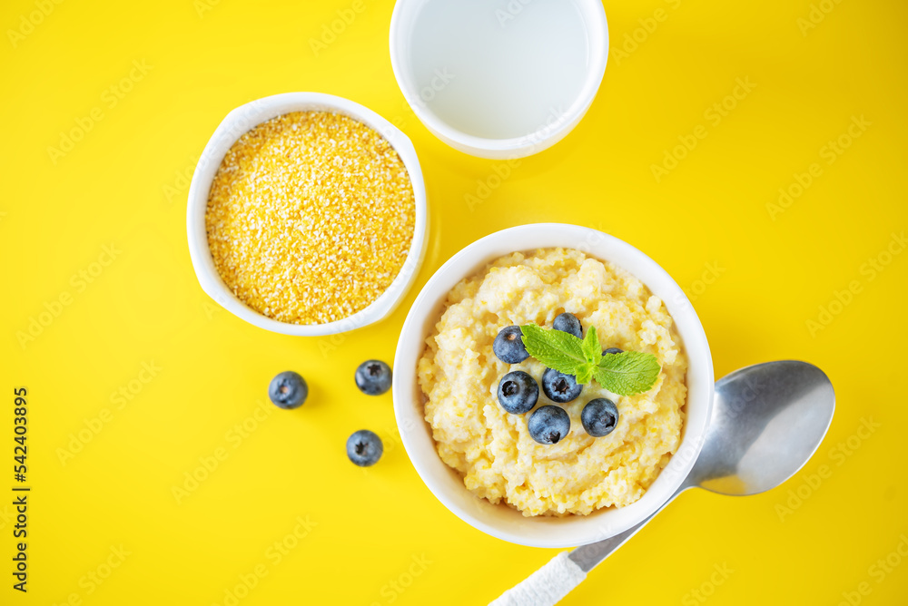 Corn porridge with fresh blueberries in a bowl Corn porridge with fresh blueberries in a bowl