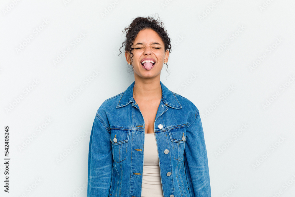 Young african american woman isolated funny and friendly sticking out tongue. Young african american woman isolated funny and friendly sticking out tongue.