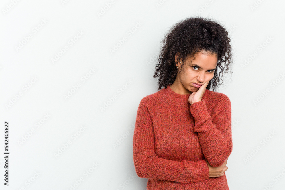 Young african american woman isolated who feels sad and pensive, looking at copy space. Young african american woman isolated who feels sad and pensive, looking at copy space.