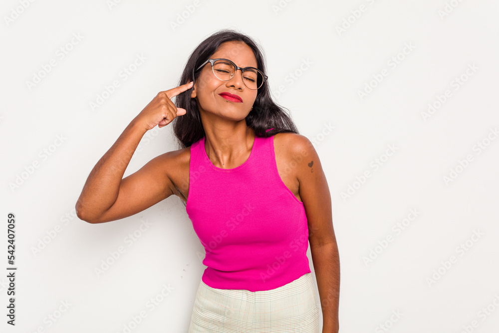Young Indian woman isolated on white background covering ears with fingers, stressed and desperate by a loudly ambient. Young Indian woman isolated on white background covering ears with fingers, stressed and desperate by a loudly ambient.