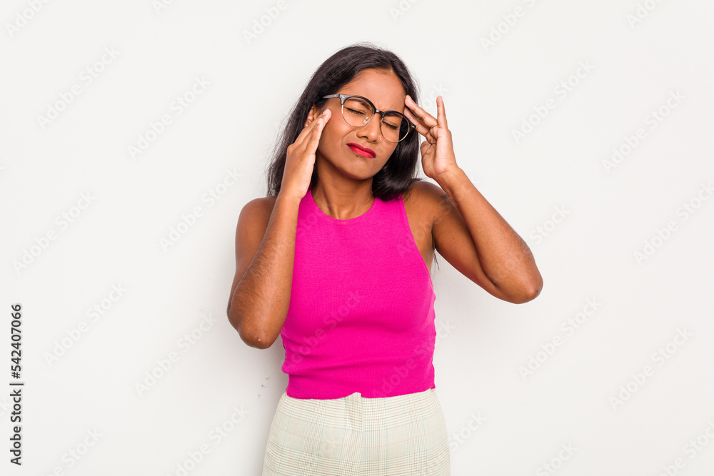 Young Indian woman isolated on white background touching temples and having headache. Young Indian woman isolated on white background touching temples and having headache.