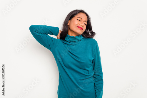 Young Indian woman isolated on white background massaging elbow, suffering after a bad movement. © Asier