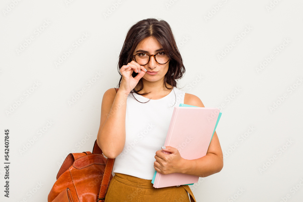 Young student Indian woman isolated on white background with fingers on lips keeping a secret. Young student Indian woman isolated on white background with fingers on lips keeping a secret.