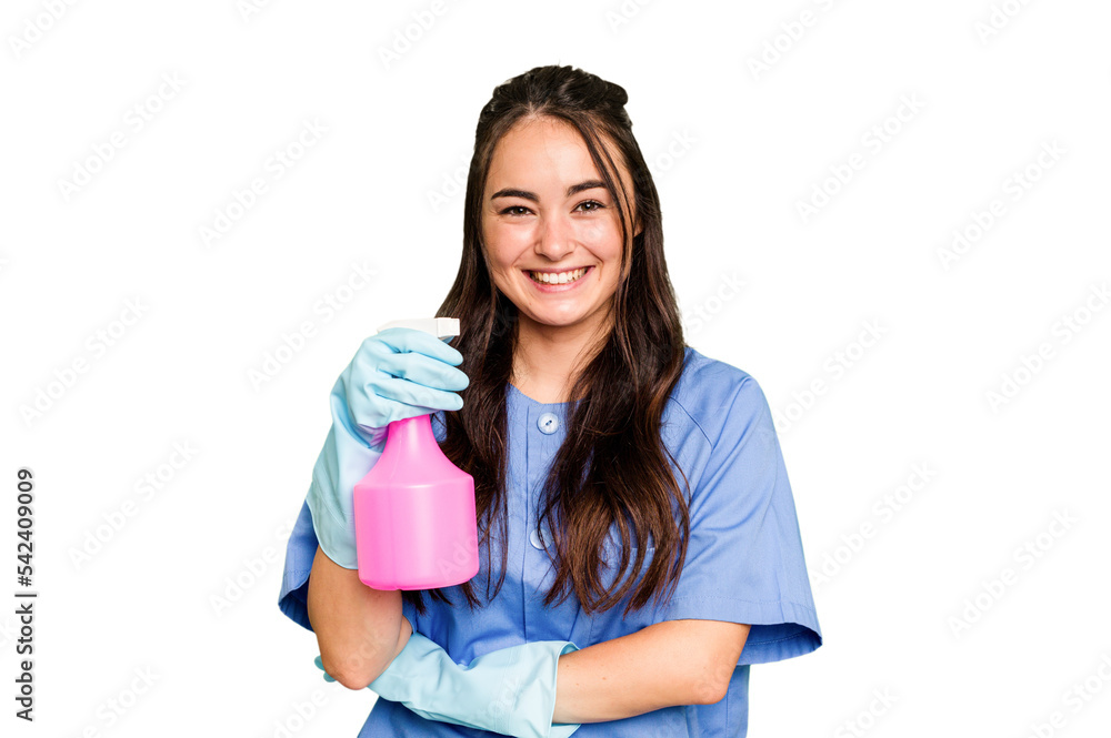 Young cleaner caucasian woman isolated on green chroma background laughing and having fun. Young cleaner caucasian woman isolated on green chroma background laughing and having fun.