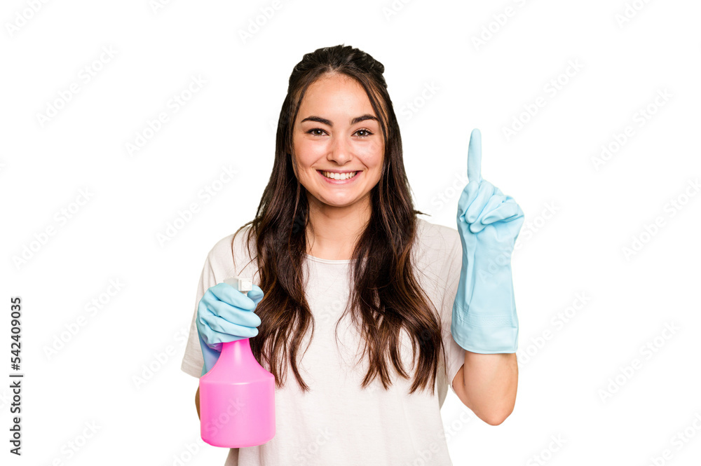Young cleaner caucasian woman isolated on green chroma background showing number one with finger. Young cleaner caucasian woman isolated on green chroma background showing number one with finger.