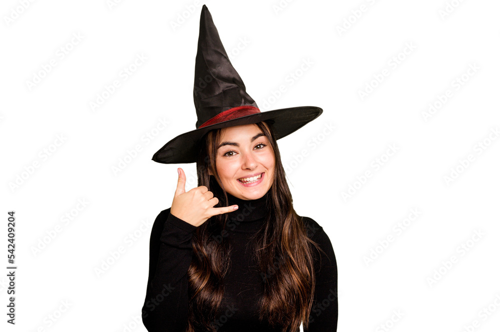 Young caucasian woman dressed as a witch isolated on green chroma background showing a mobile phone call gesture with fingers. Young caucasian woman dressed as a witch isolated on green chroma background showing a mobile phone call gesture with fingers.