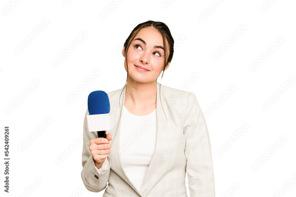 Young TV presenter caucasian woman isolated on green chroma background dreaming of achieving goals and purposes Young TV presenter caucasian woman isolated on green chroma background dreaming of achieving goals and purposes