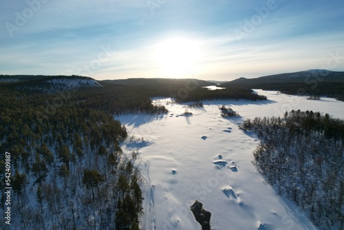 Low sun over Inari river near Inari lake Finland  Lapland