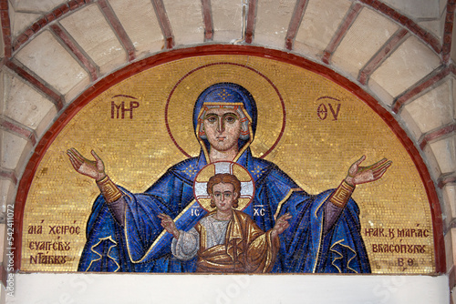 Colourful mosaic hagiography of Mother of God ,on the facade above the entrance of the church of Panagia Giatrissa in Loutraki, Greece 