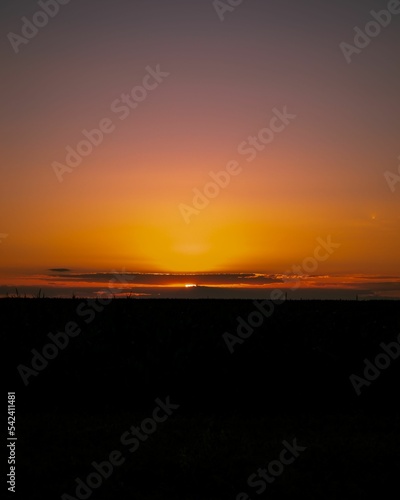 Scenic view of the sunset over a vast landscape