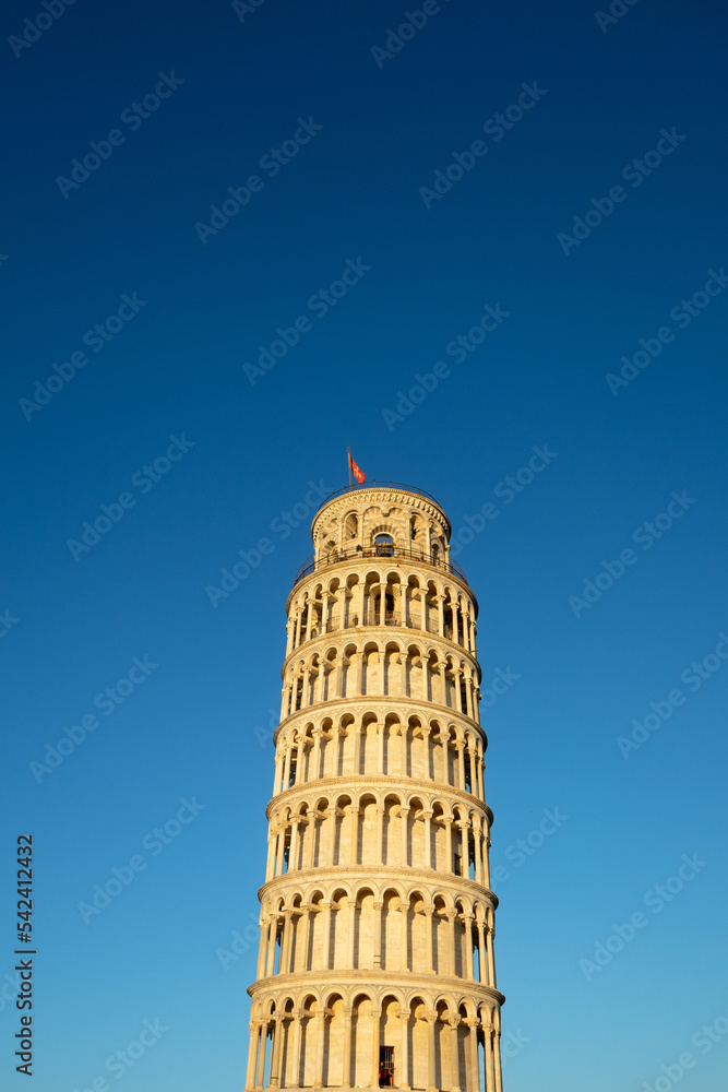 Pisa tower sunset light colors against blue sky low angle view