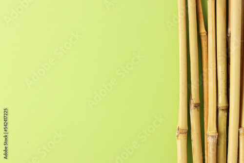 Eco bamboo on brown background. Concept, natural material organic cutlery, zero waste, eco-friendly, copyspace (ID: 542417225)