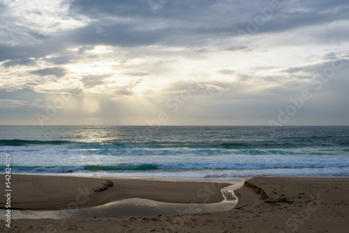Fototapeta Naklejka Na Ścianę i Meble -  Cloudy sky on Mollymook beach, near Uladulla, Australia