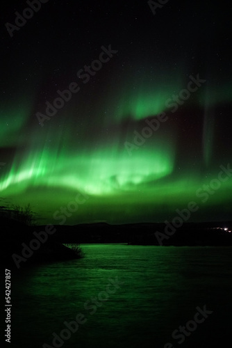 Aurora in the sky over a lake © Katelin