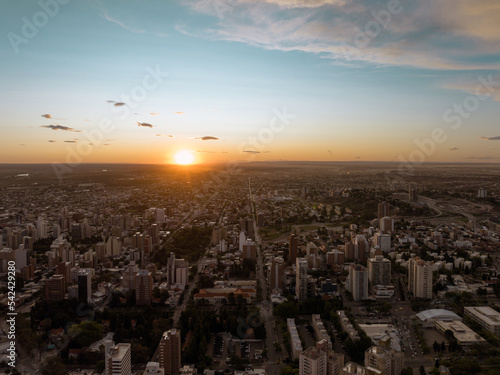 Sun falling dawn in the city. Aerial drone view at sunset