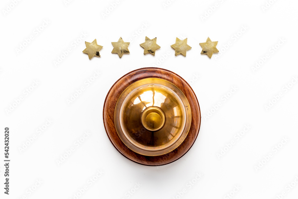 Hotel service bell with five stars as symbol of quality of hotel Hotel service bell with five stars as symbol of quality of hotel