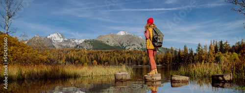 Rear view of woman enjoying view at mountains. photo