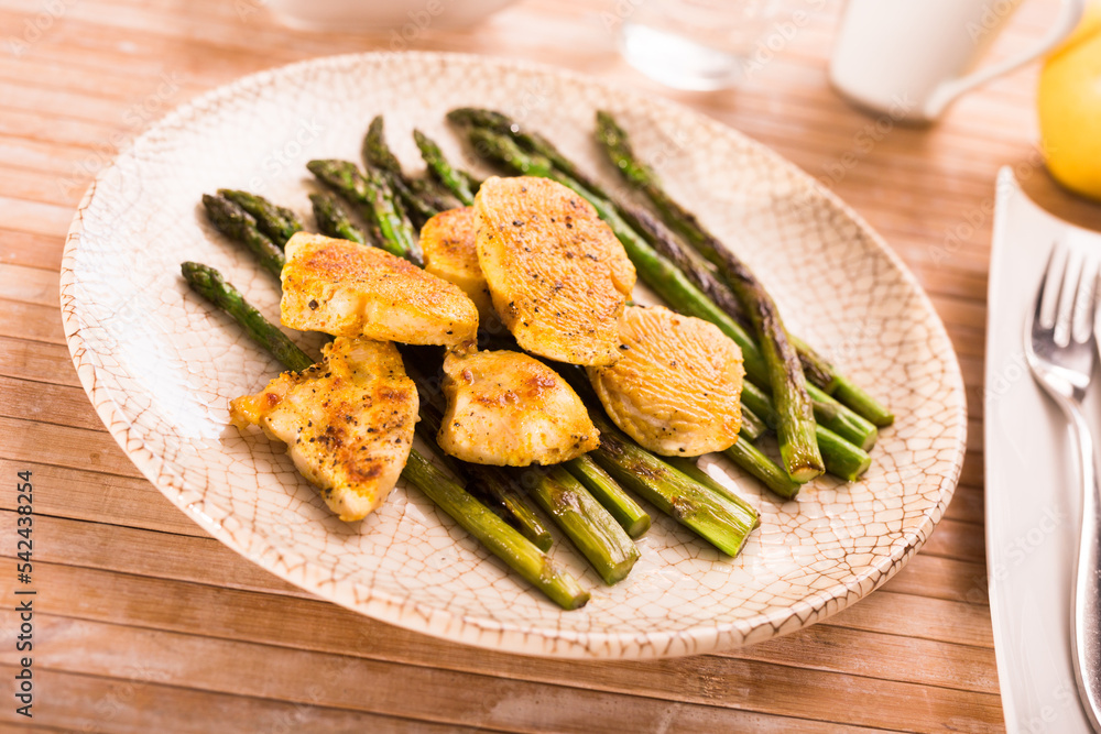 dietary meal rich in protein. Stir fried chicken breast and green asparagus dietary meal rich in protein. Stir fried chicken breast and green asparagus
