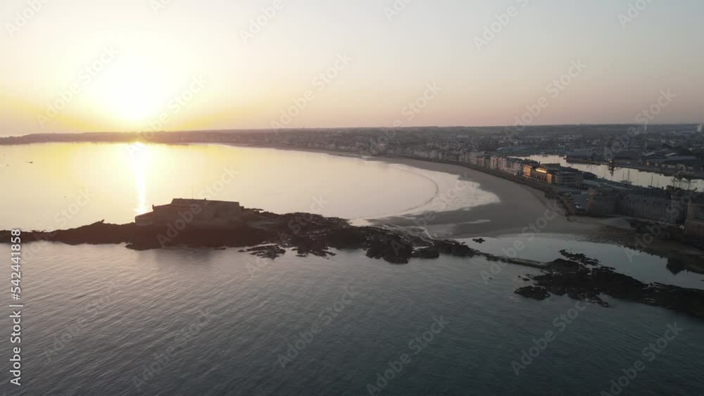 Saint-Malo walls and Fort du Petit Bé at sunset, Brittany in France. Aerial sideways and sky for copy space Saint-Malo walls and Fort du Petit Bé at sunset, Brittany in France. Aerial sideways and sky for copy space