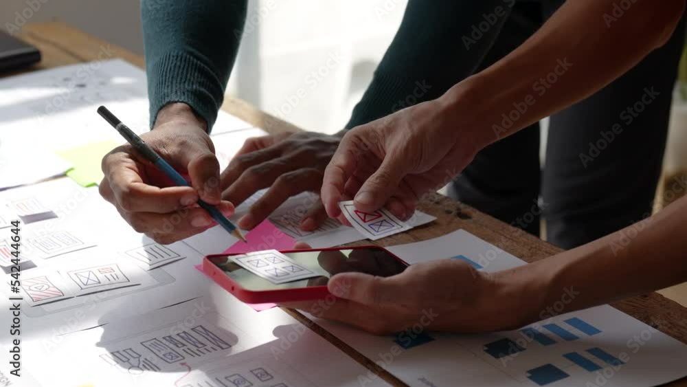 Group of ux developer and ui designer brainstorming about app interface design at modern office. Creative digital development agency