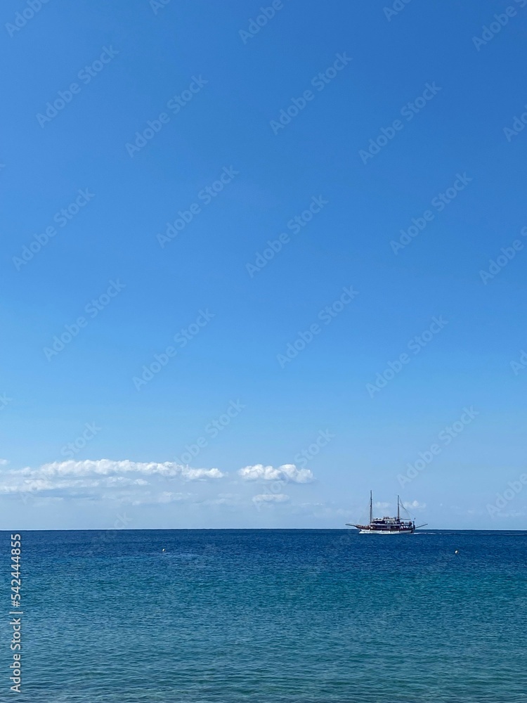 Vertical shot of a ship in the sea