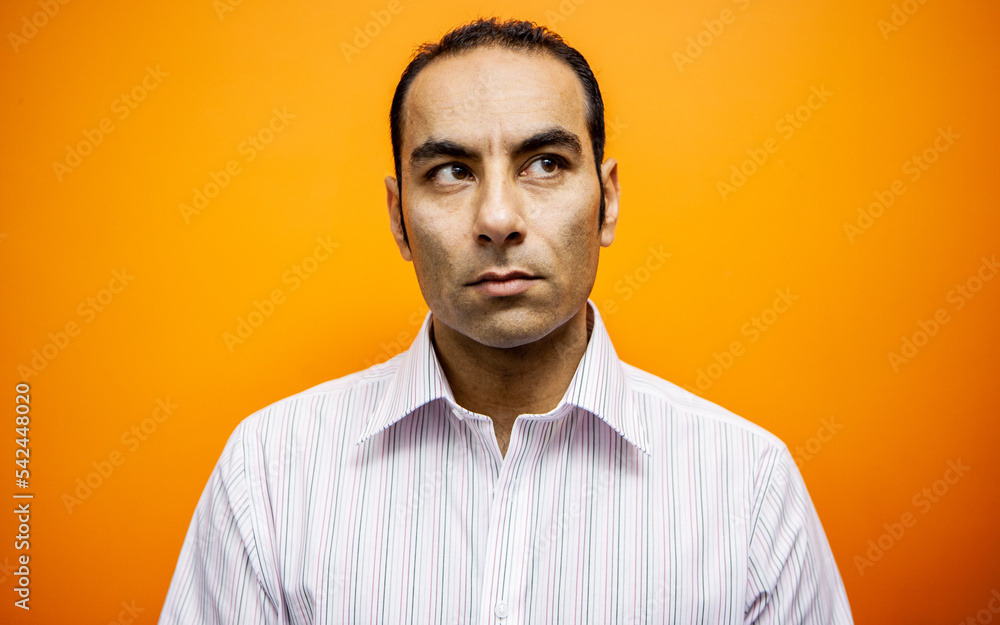 Emotions and Expressions: Uncertain. A concerned look and expression on the face of a mixed race mature man. From a series of related images. Emotions and Expressions: Uncertain. A concerned look and expression on the face of a mixed race mature man. From a series of related images.