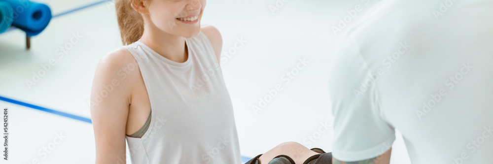 Teenage girl after car accident with orthosis on the leg exercis Teenage girl after car accident with orthosis on the leg exercis