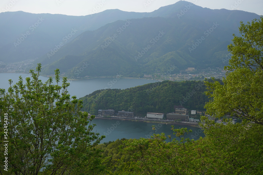 Lake kawaguchiko hotel and beautiful surrounding mountain views.