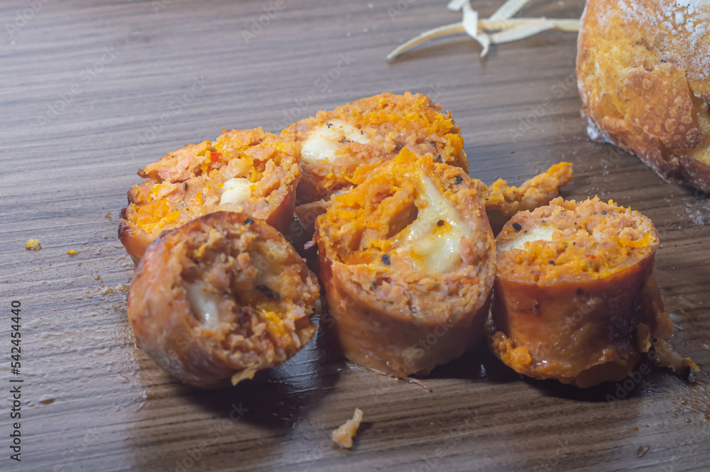 Pumpkin sausage made with Pumpkin and cheese, copy space on the left and soft light Pumpkin sausage made with Pumpkin and cheese, copy space on the left and soft light