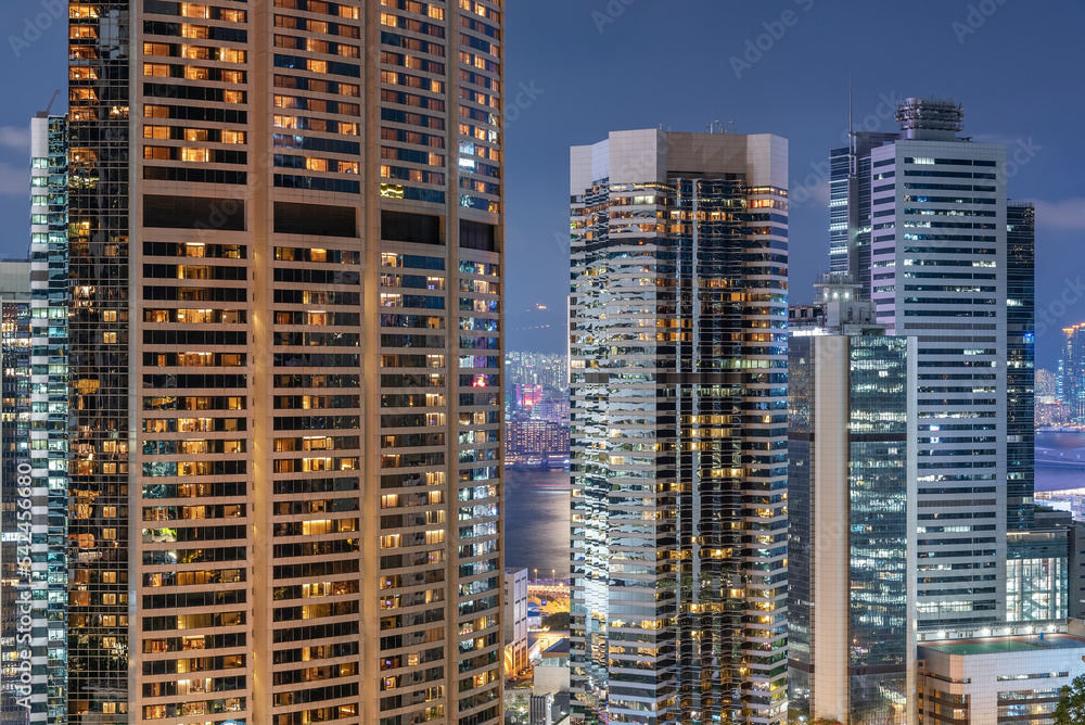 High rise modern office building in Hong Kong city at night High rise modern office building in Hong Kong city at night