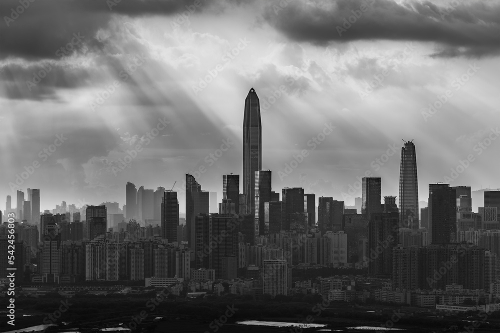 Silhouette of skyline of Shenzhen city, China under sunset. Viewed from Hong Kong border Silhouette of skyline of Shenzhen city, China under sunset. Viewed from Hong Kong border