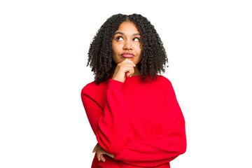 Young african american woman isolated relaxed thinking about something looking at a copy space.