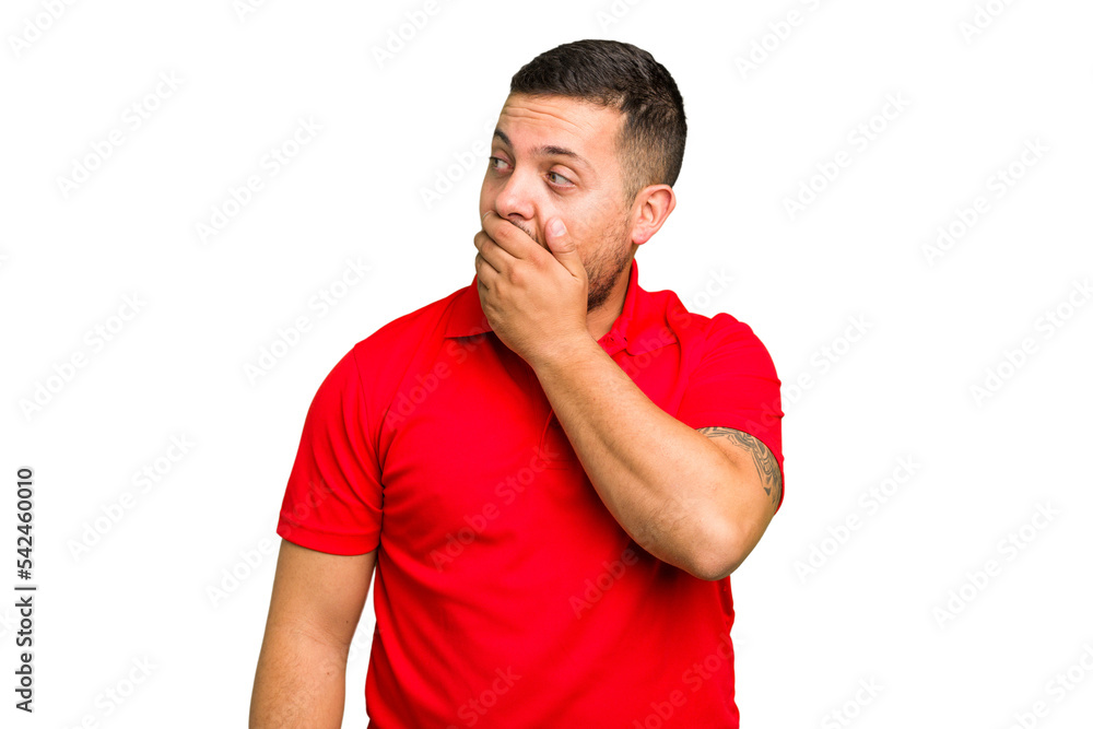 Young caucasian man isolated thoughtful looking to a copy space covering mouth with hand. Young caucasian man isolated thoughtful looking to a copy space covering mouth with hand.