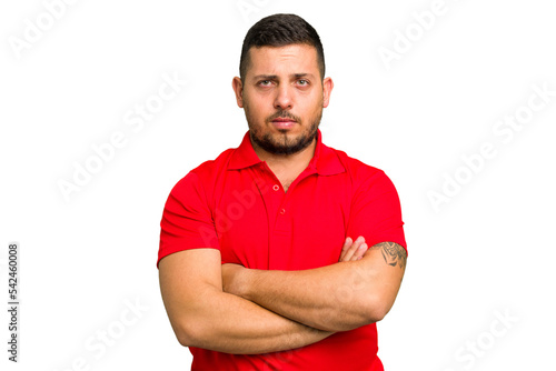 Canvas Print Young caucasian man isolated frowning face in displeasure, keeps arms folded