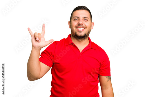 Young caucasian man isolated showing a horns gesture as a revolution concept.