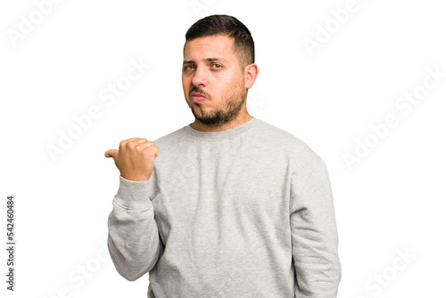 Tableau sur toile Young caucasian man isolated shocked pointing with index fingers to a copy space