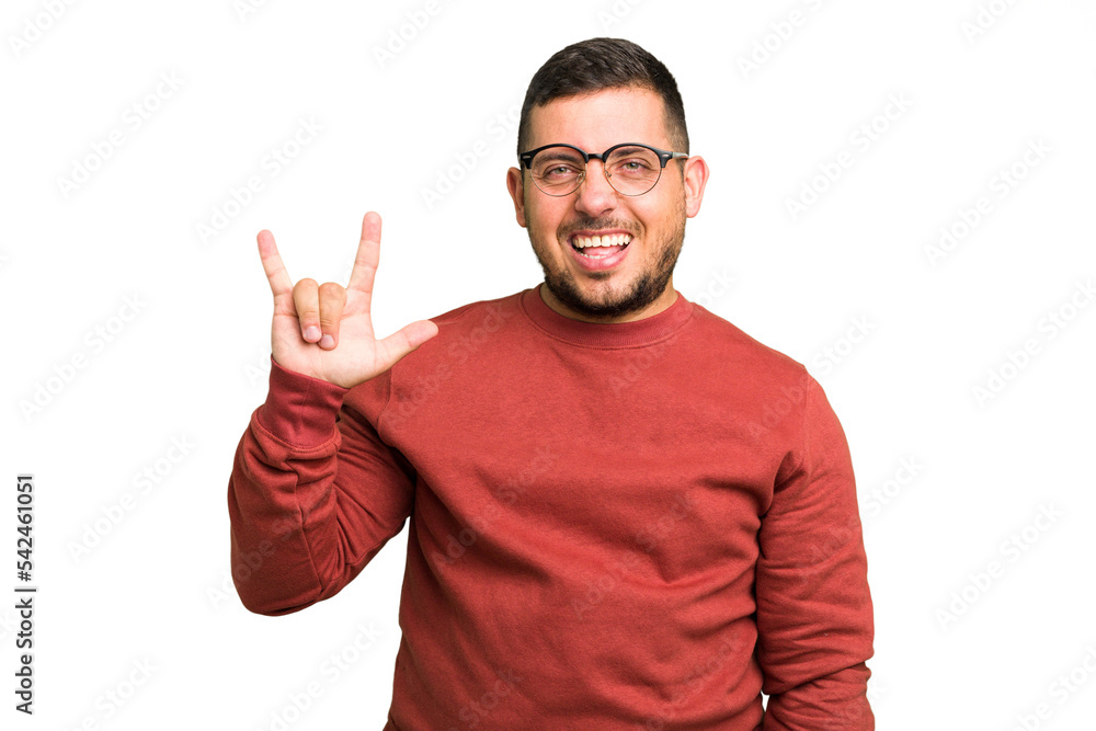 Young caucasian man isolated showing a horns gesture as a revolution concept. Young caucasian man isolated showing a horns gesture as a revolution concept.