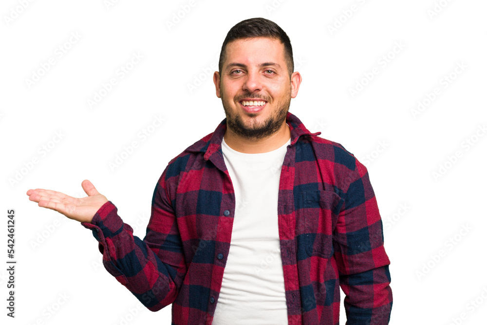 Young caucasian man isolated showing a copy space on a palm and holding another hand on waist. Young caucasian man isolated showing a copy space on a palm and holding another hand on waist.