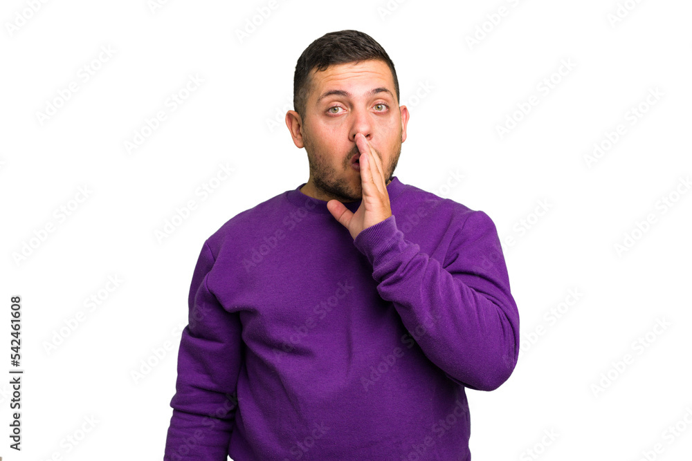 Young caucasian man isolated is saying a secret hot braking news and looking aside Young caucasian man isolated is saying a secret hot braking news and looking aside
