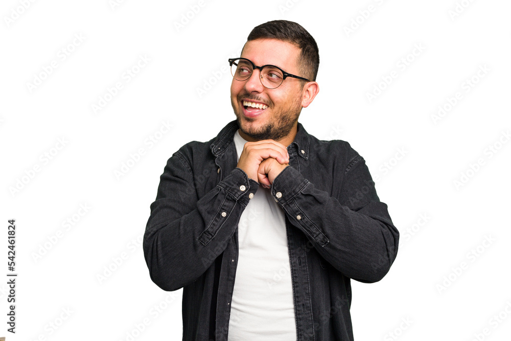 Fototapeta premium Young caucasian man isolated praying for luck, amazed and opening mouth looking to front.