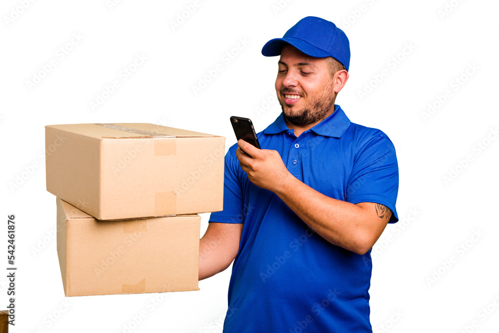 Delivery caucasian man delivering packages and using his mobile phone isolated Delivery caucasian man delivering packages and using his mobile phone isolated