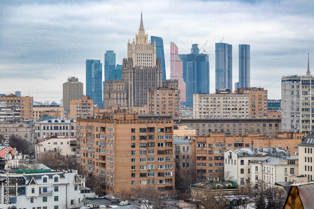 Fototapeta premium Stalin's high-rise on the background of Moscow City in Moscow