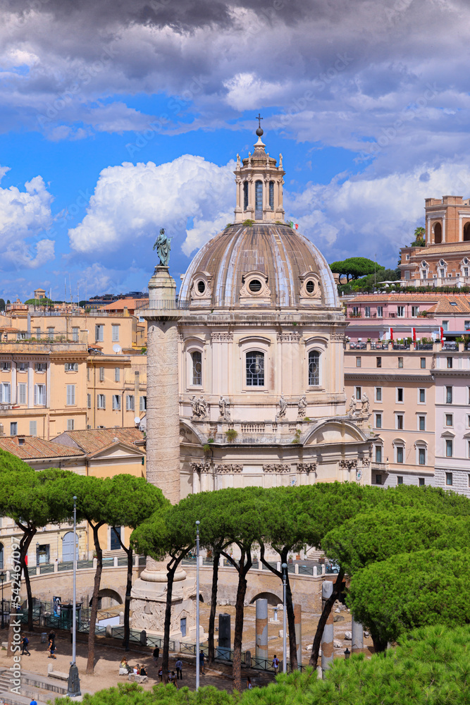 Rome skyline: view of Trajan’s Column and The Church of the Most Holy Name of Mary at the Trajan Forum, Italy.