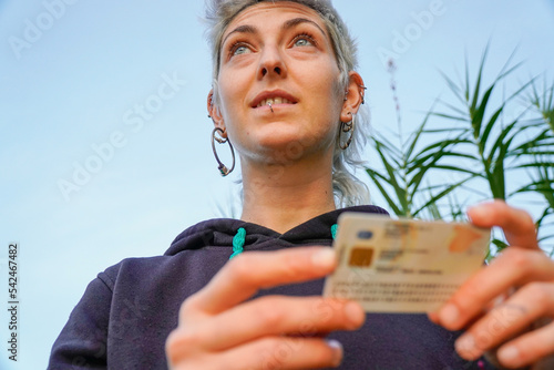 non-binary person with their new name on the identity card. Gender identity photo