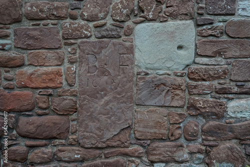 Inscription on the chapter house at the ruins of the Church of Saint Peter and Saint Boniface of Fortrose (c. 1200) on the Black Isle, in the Highlands of Scotland. photo