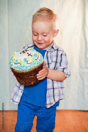 boy holding easter cake